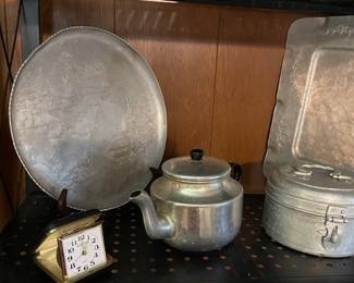 Tin and aluminum items, of and a random clock - tick tock