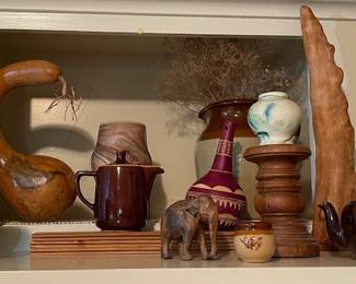 More pottery, a gourd, and wooden decor items