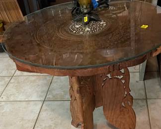 Stunning hand carved vintage table with glass top