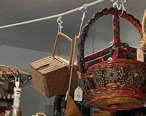 This home is packed with baskets through out the inside and in the garage, look up, down, all around and you're likely to find a basket - it may be being used for display, but ALL are available for sale