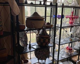 My apologies for this dark picture - but I wanted to capture the shape of the stunning raw hide basket with lid on the second shelf - it is a white multi-color hide.  Great vintage piece.