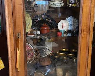 Another picture of the armoire which is full of asian collectibles and relics