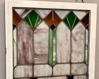 Two matching vintage stained glass windows.
27” x 28” - Wood frame painted white on one side and natural wood on the other.  