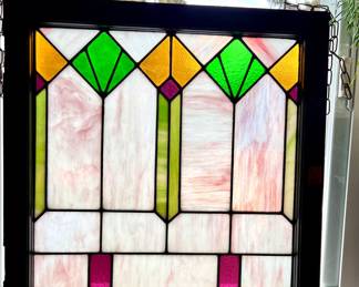Two matching vintage stained glass windows.
27” x 28” - Wood frame painted white on one side and natural wood on the other.  