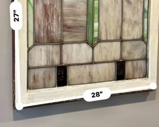 Two matching vintage stained glass windows.
27” x 28” - Wood frame painted white on one side and natural wood on the other.  Window on the right has three cracked pieces of glass