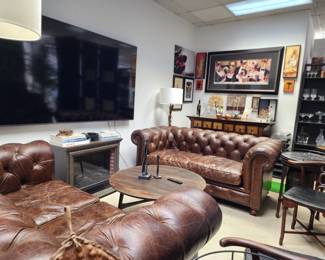 Leather sofas, wall art, transformative buffet  console.