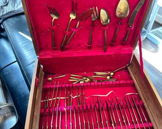 #106 - $150 - Bangkok Thailand Gold color flatware - 12 tea spoons - 12 soup spoons - 12 dinner spoons - 1 oyster spoon - 12 dinner knives - 12 butter knives - 12 - caviar spoons - 12 small knives - 10 serving utensils