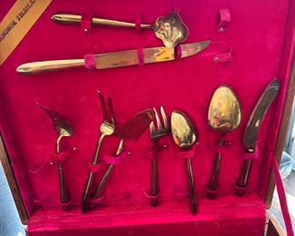 #106 - $150 - Bangkok Thailand Gold color flatware - 12 tea spoons - 12 soup spoons - 12 dinner spoons - 1 oyster spoon - 12 dinner knives - 12 butter knives - 12 - caviar spoons - 12 small knives - 10 serving utensils