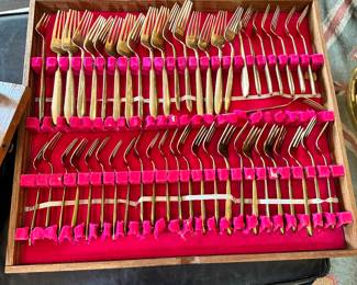 #106 - $150 - Bangkok Thailand Gold color flatware - 12 tea spoons - 12 soup spoons - 12 dinner spoons - 1 oyster spoon - 12 dinner knives - 12 butter knives - 12 - caviar spoons - 12 small knives - 10 serving utensils