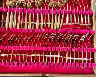 #106 - $150 - Bangkok Thailand Gold color flatware - 12 tea spoons - 12 soup spoons - 12 dinner spoons - 1 oyster spoon - 12 dinner knives - 12 butter knives - 12 - caviar spoons - 12 small knives - 10 serving utensils
