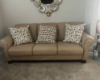 #44 $200	Tan leather sofa  66wx39dx37h
