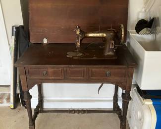 #58 $100	Domestic sewing machine in cabinet 35wx18dx30h	
