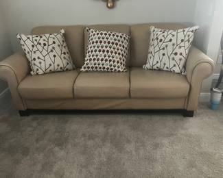 #44 $200	Tan leather sofa  66wx39dx37h