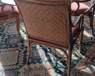 Round glass table with rattan chairs 