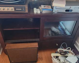 entertainment cabinet, turntable, CD/VHS player, vintage speaker, cords