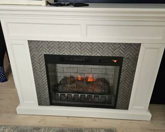 Large like new electric fireplace $200. Comes with remote 