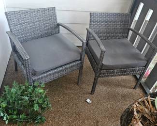 Pair of plastic rattan patio chairs $60