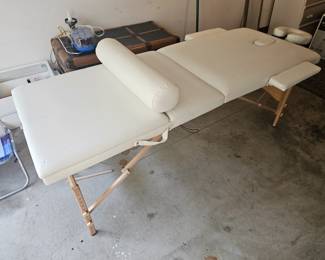 Practically new folding massage table with head rest, face removal hope, removable arm rests. ( No storage bag) $125