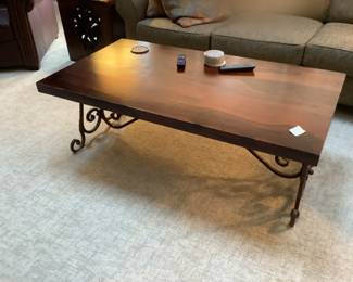 Wood coffee table with wrought iron legs…presale $125