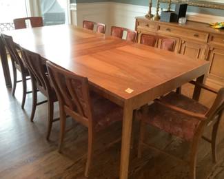 French walnut dining room table with two leaves, pads and eight chairs.  Seats twelve.  Presale available.