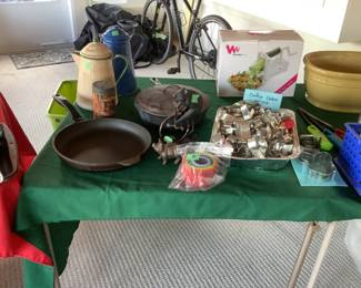 Cast irons pans, enamelware pots, cookie cutters, 
