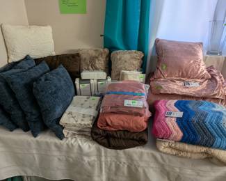 Bed linens, decorative pillows, curtains etc