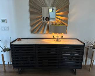 Side buffet cabinet, decorative mirror, table lamp, indoor plants