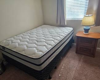 New full size bed with box spring on metal frame. $100 Don't think it's ever been slept on
