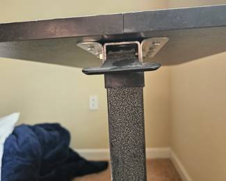 Underside of rolling adjustable table this is the lever that raises and lowers it