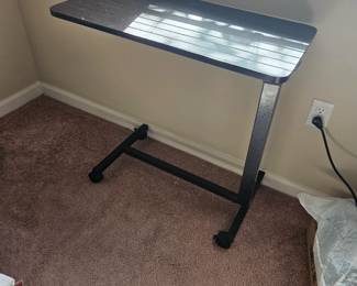 Adjustable height rolling table for bed, either can be used for food or homework, even computer time $50