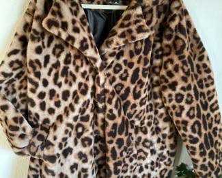 Snuggle up in this faux leopard coat XL and soft for days