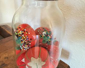 Someone had a nice pin cushion collection going in this vintage Clark jar… perhaps you can add to it!