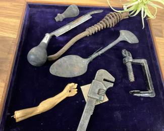 Vintage hand tools and Jesus arm