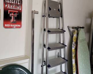 Paint ladder, ironing boards and Texas Tech parking sign