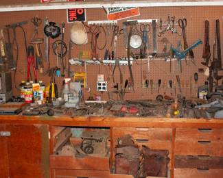 Hand tools (screwdrivers, hammers, drill bits, scissors), WWII era radios
