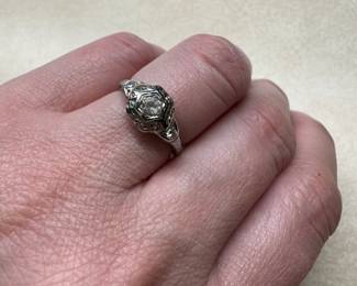 18 k imitation center stone but side diamonds are real 