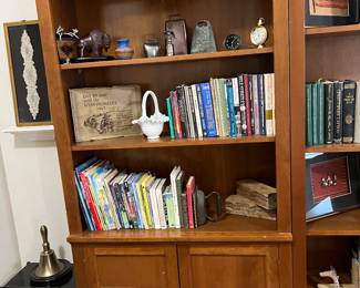 BOOKS AND DECOR.  SHELVING STAYS WITH HOME AND IS FOR DISPLAY PURPOSES ONLY