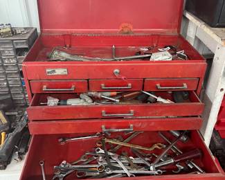 Red metal tool box and tools