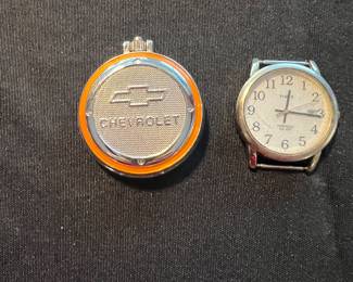 Chevrolet pocket watch closed 
Timex watch 
