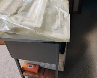 electric typewriter on metal typewriter table