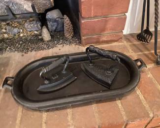 Antique irons and iron tray.