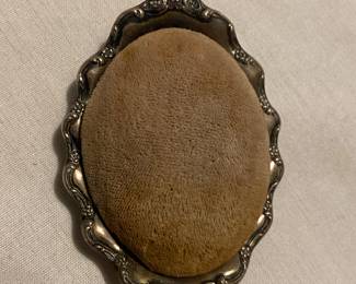 Sterling pin cushion.