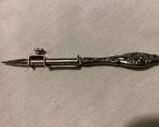 Sterling handle sewing awl. 
