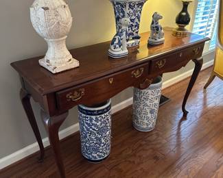 Blue and white pottery umbrella stands, cherry sofa table