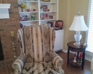 Wingback upholstered chair, teapots, candles, decor,lamps