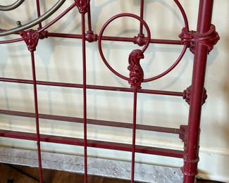 Bed has great iron work......(has rails)