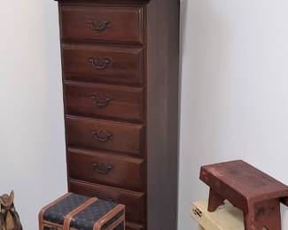 Stack of Painted Stools, tall narrow drawered chest, set of graduated suitcases, wood rocking horse