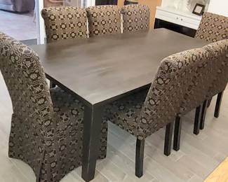 Beautiful painted black Dining room table. Set of 8 "Lovers Knot" pattern custom upholstered Johnston Benchworks parsons side chairs
