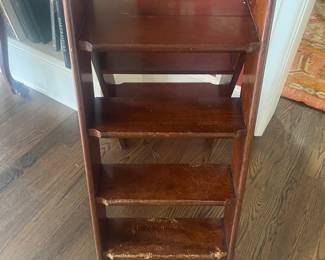 $60. Foldable library ladder.  16"w x 30"d x 37"h as shown in this photo.  Itis as found with some dog damage on the lower step.