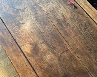 Photo of the surface of the coffee table. Flash makes it look lighter but it matches the table.